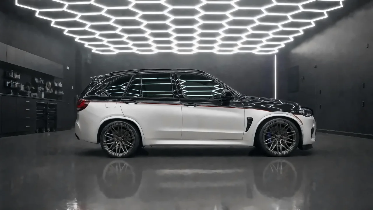 BMW X5 M · two-tone, gloss black over satin white with a red pinstripe (studio illustration)